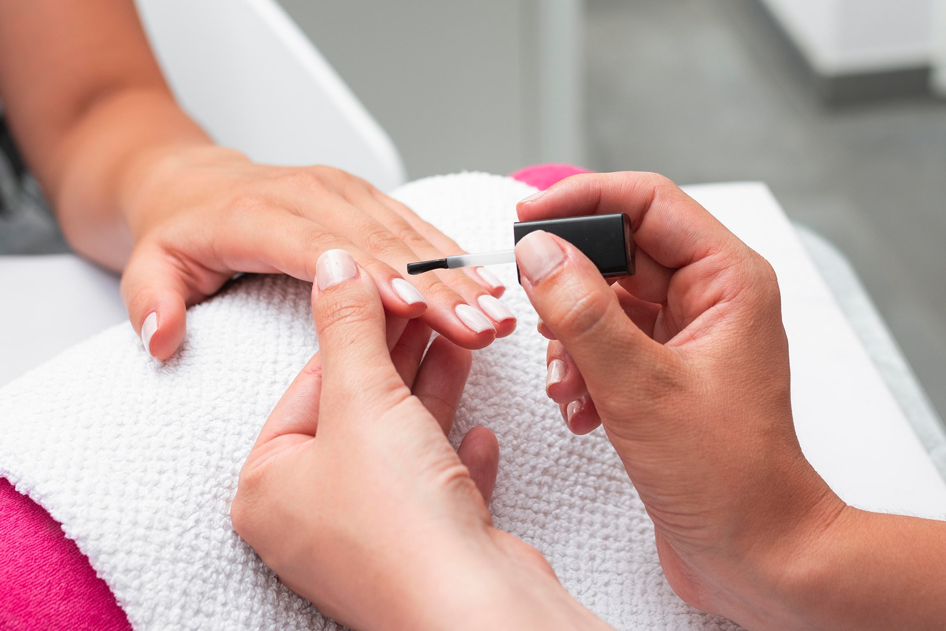 high-angle-woman-doing-manicure-client