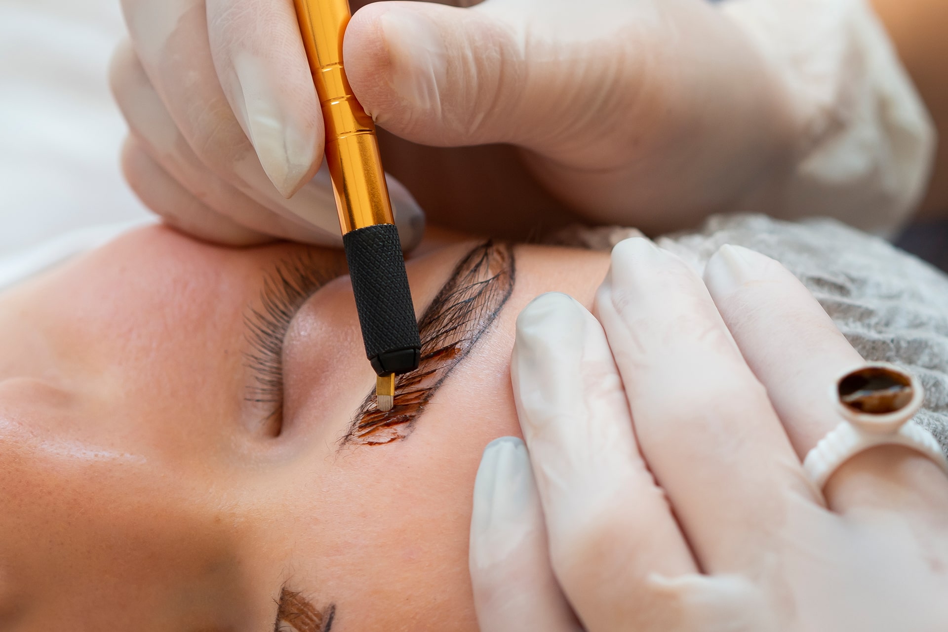 young-woman-going-through-microblading-procedure young-woman-going-through-microblading-procedure